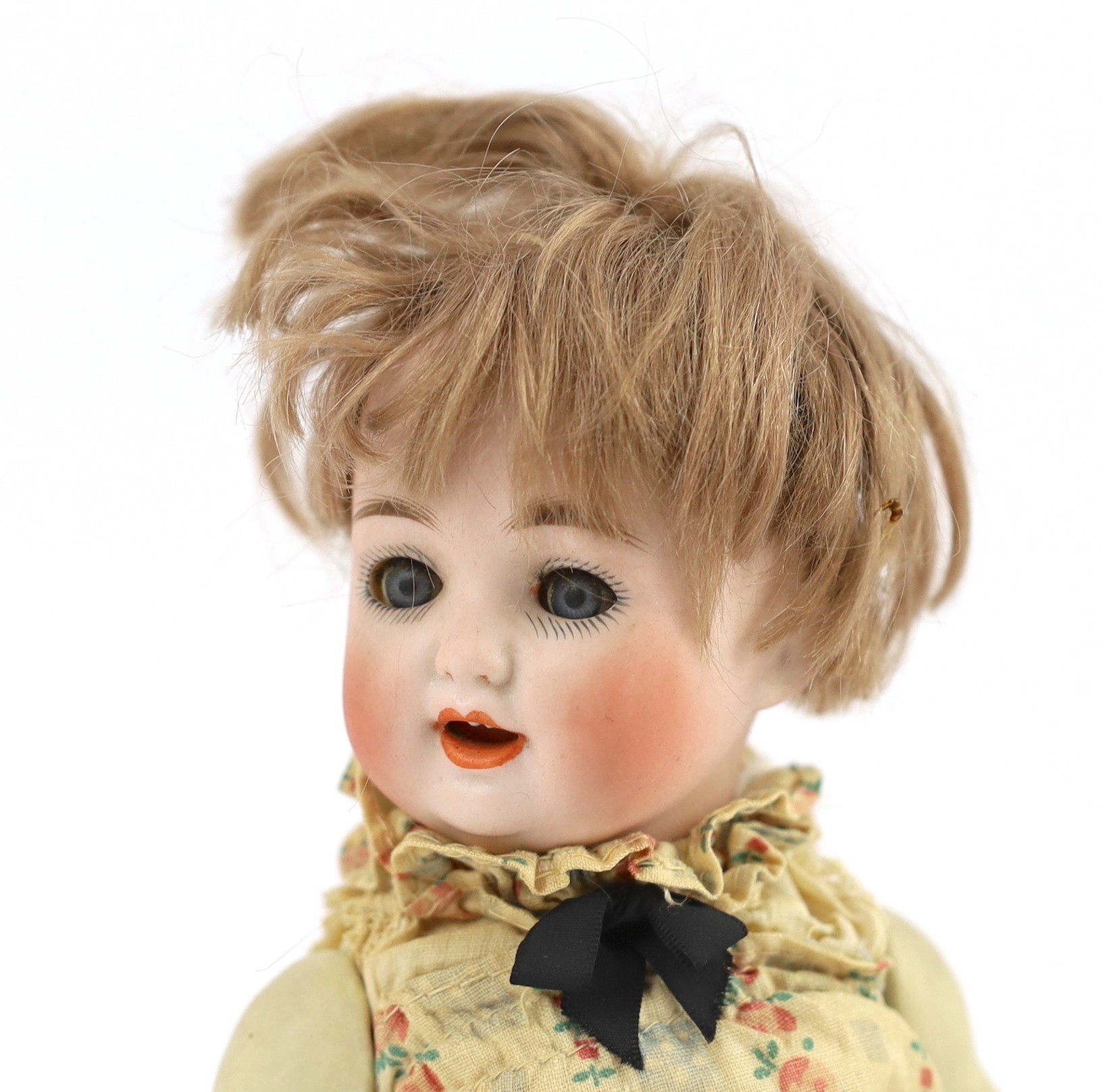 A bisque doll, German, circa 1914, 11in.